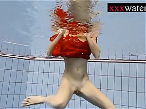 spectacular hot dame swimming in the pool
